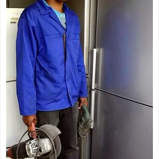 Mobile Fridge Repairs technician working on a fridge