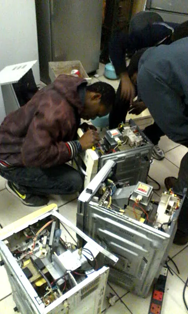 Appliance part being repaired on the workbench